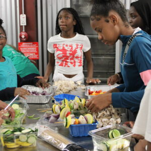 Children helping to prepare food